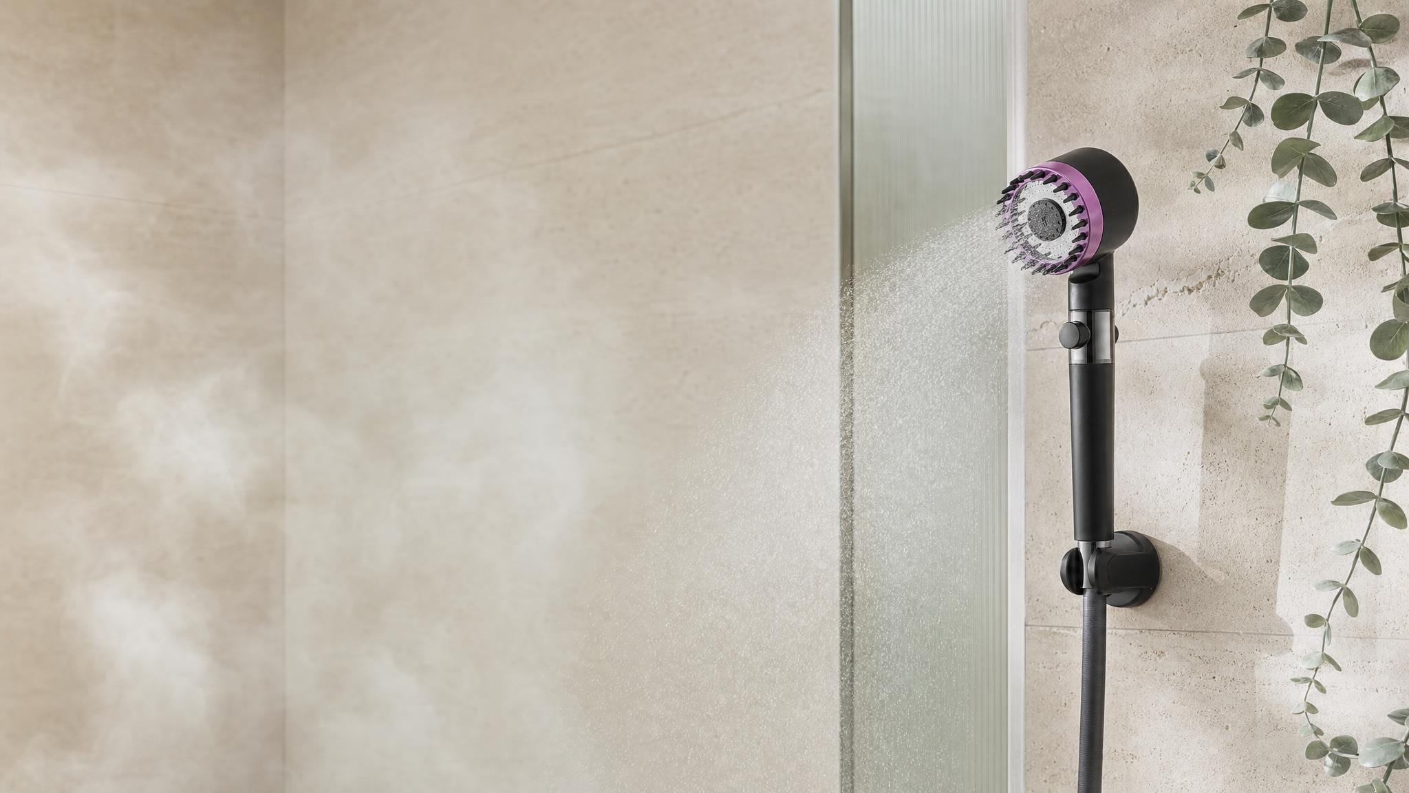 Navenz filtered shower head spraying soft water in a bright spa shower